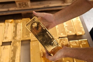 You can take a distribution, but still elect to keep your gold bullion as an investment.