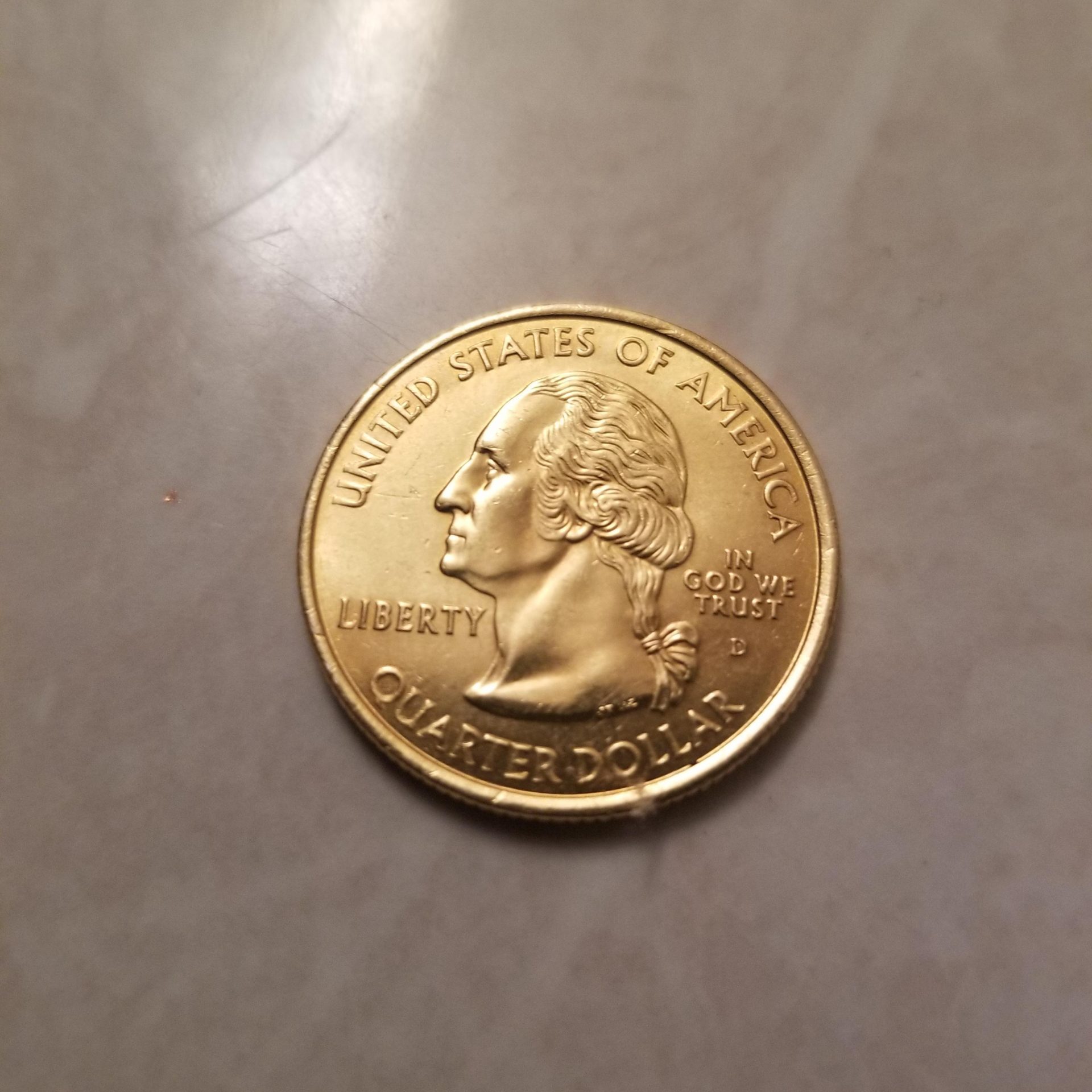 How Much Is A Gold Plated Quarter Worth? | Gold IRA Guide