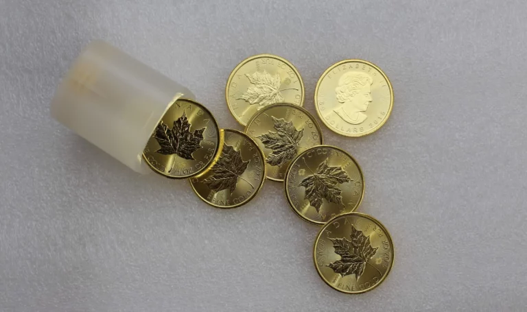 Gold coins displayed on a surface.